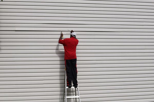 Loose Siding Repair in Garland