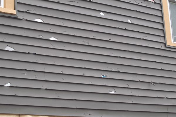 Damaged Siding Replacement in Garland